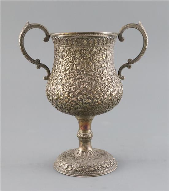 An early 20th century Indian Kutch silver two handled pedestal cup, 20 oz.